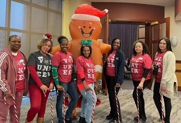 CCM team with inflatable gingerbread man