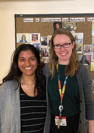 Pooja and Hannah Volunteer 