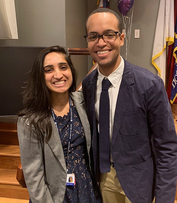 two interns embracing