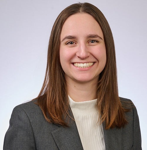 woman in black blazer and white shirt