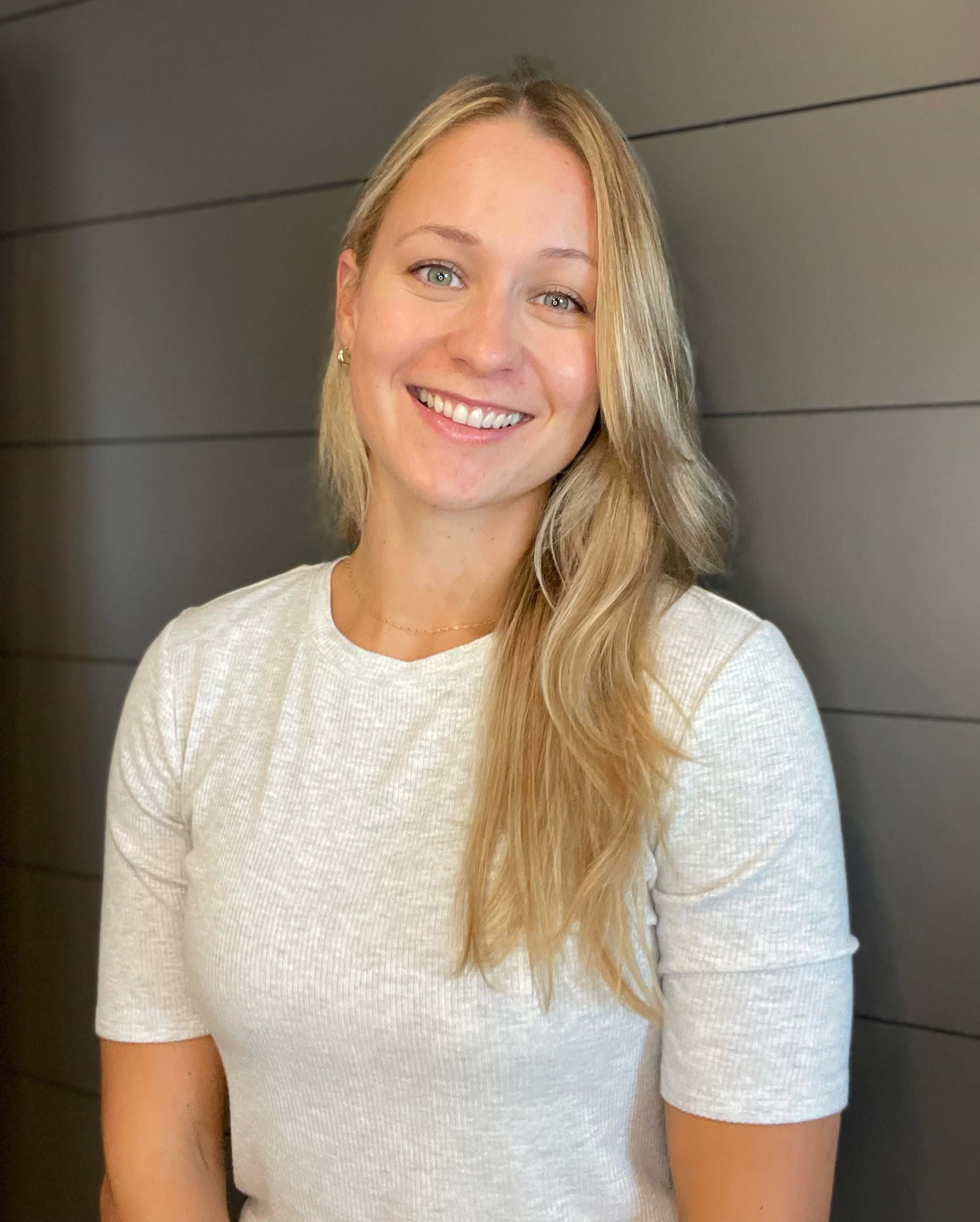 blonde woman wearing a white shirt