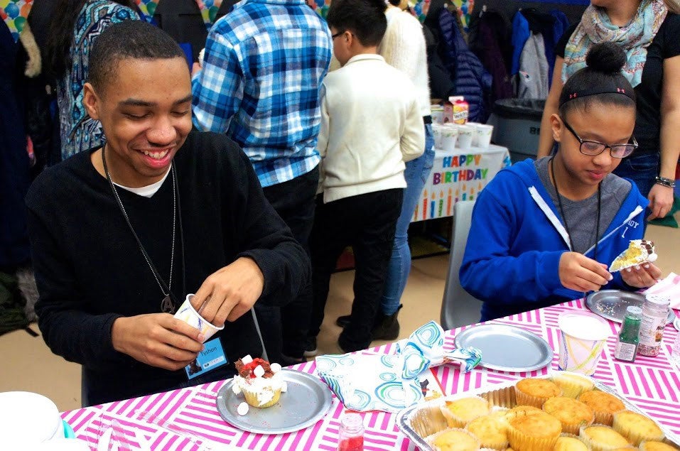 Cupcake decorating at a birthday bash event.