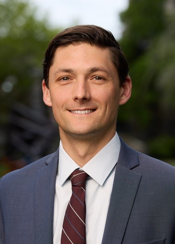 man in suit with red tie