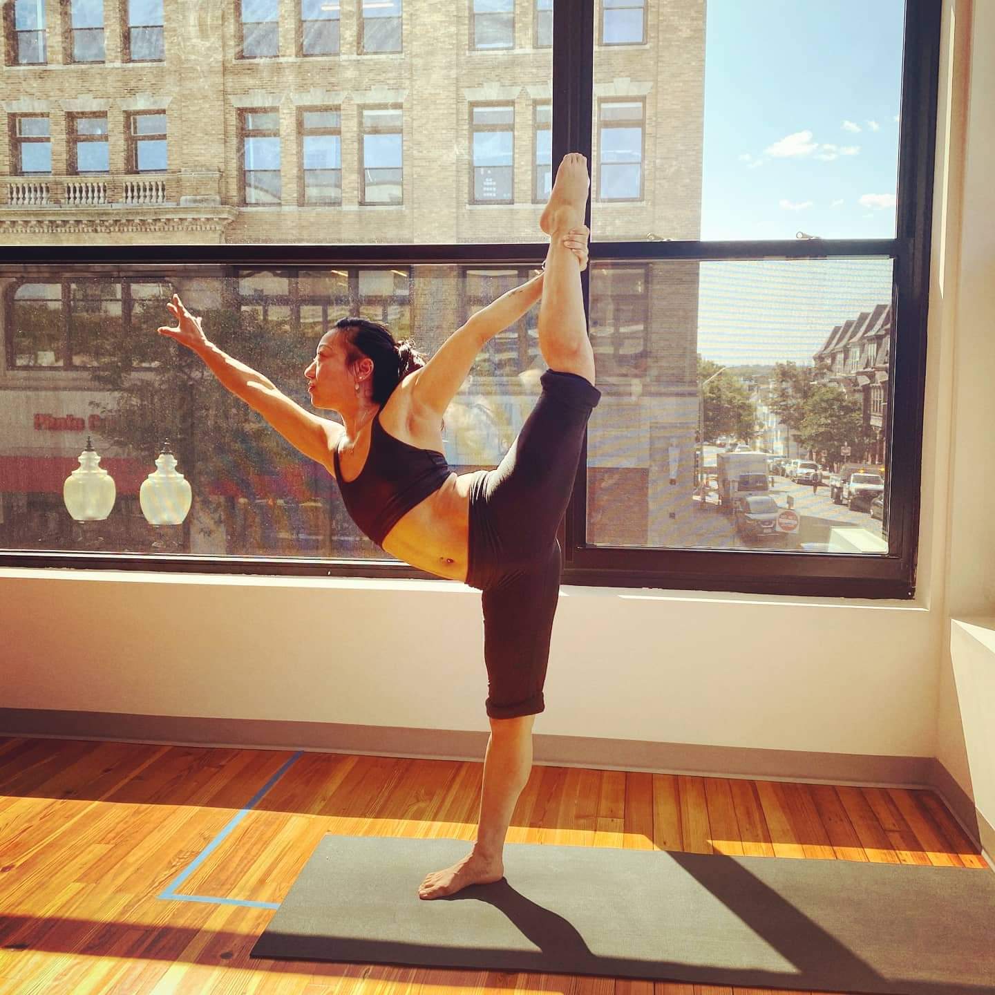 Asia Mei doing a yoga stretch