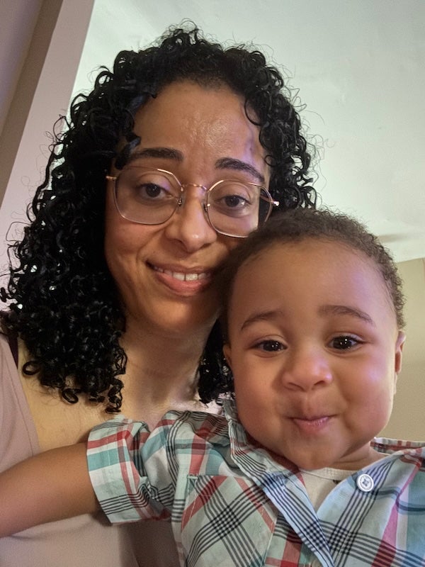 Luci Pires holds her smiling 13-month-old, Alessandro