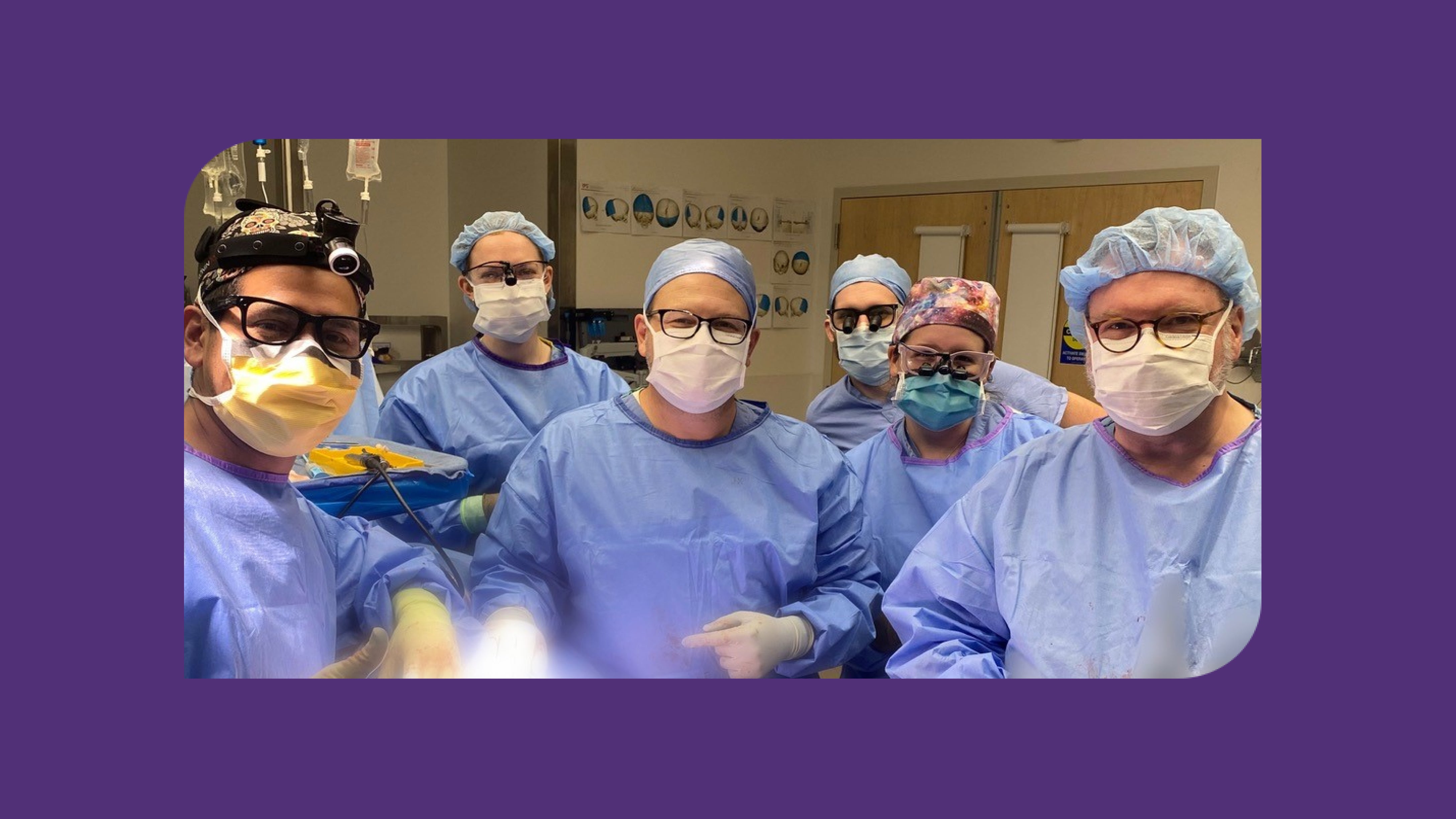 Dr. Jorge Lujan (left), Dr. Andrew Scott (center), and Dr. James Holsapple (right) with residents from multiple specialties (back) who are part of BMC’s pediatric craniofacial team.