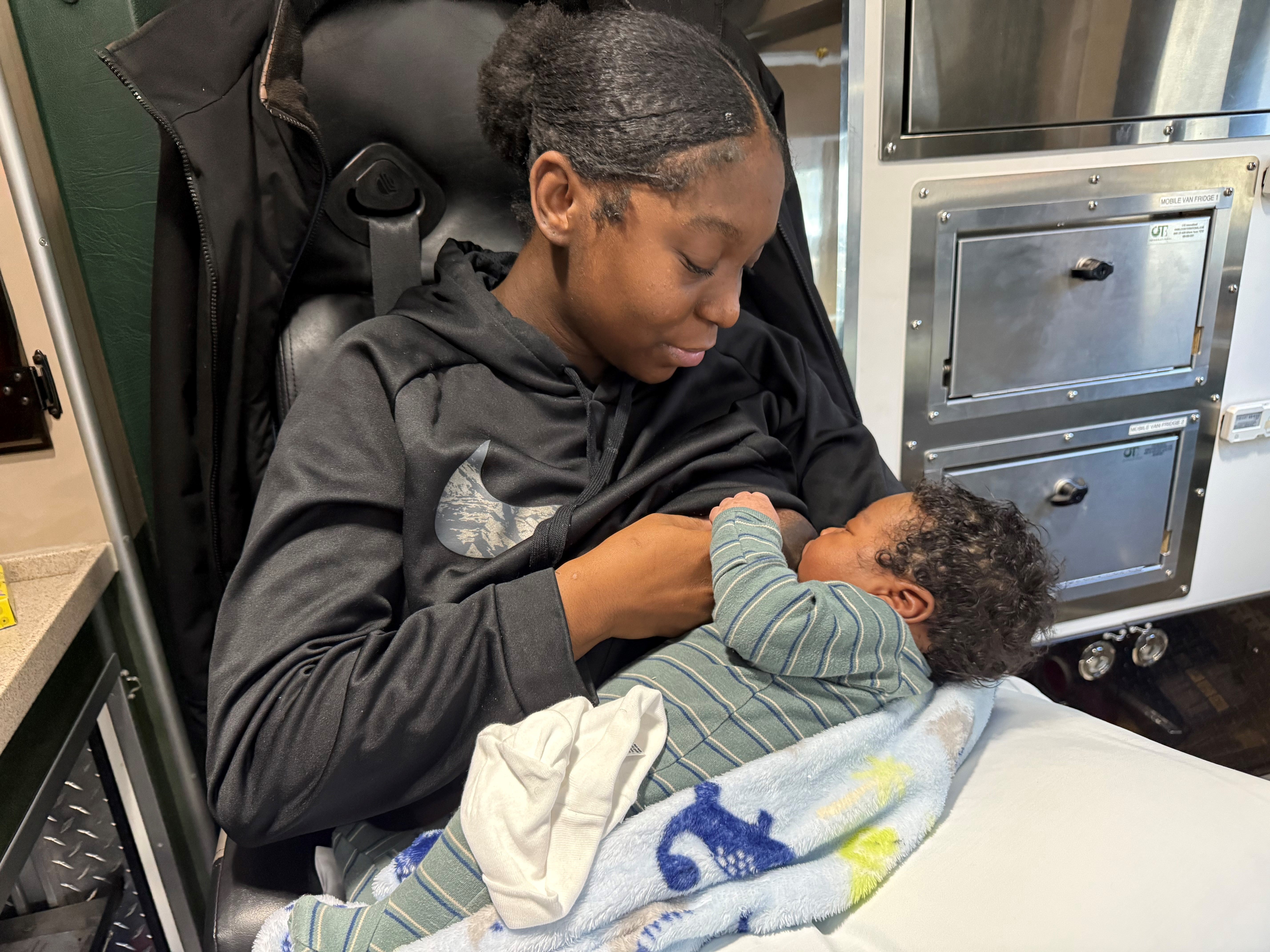 woman breastfeeding her child