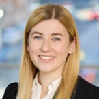 blonde woman wearing a white shirt and black blazer