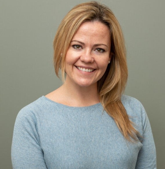 blonde woman in blue shirt