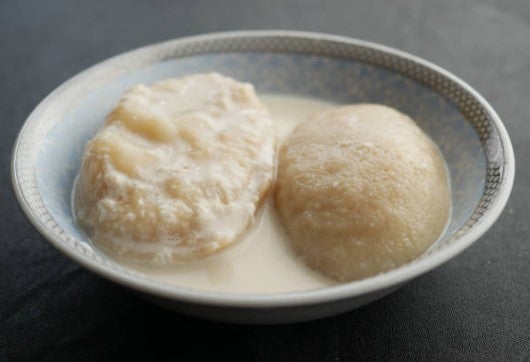 Puli Pitha in Milk Mixture