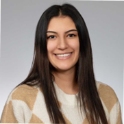 woman in tan and white sweater